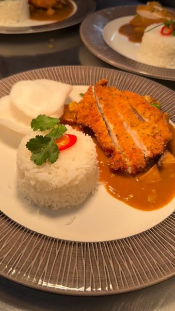 Chicken Katsu curry with steamed rice and prawn crackers - one of our lunch menu’s delicious dishes